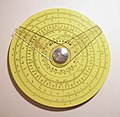 Pickett circular slide rule with two cursors. (4.25 in/10.9 cm width) Reverse has additional scale and one cursor.