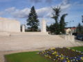 Flower bed and steps in front of the memorial, with two of the four pillars.