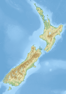 Relief map of New Zealand with a red dot in the upper South Island showing the location of the cave system
