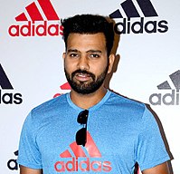 Picture of Sharma wearing a blue adidas T-shirt