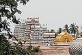 Image 30The golden Vimana over the sanctum at Srirangam midst its gopurams, its gable with Paravasudeva image. (from Tamils)
