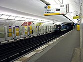 MP 89 rolling stock arriving at Les Sablons. Note the automatic platform gates on the westbound platform