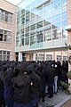 Students watch as teachers try to save a trapped sparrow