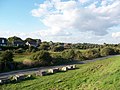 Seaside bungalows seen from the Environment Agency's road from Winchelsea Beach to Rye Harbour