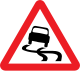 Slippery road ahead sign.