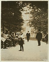 A boy selling newspapers in Union Square in July 1910