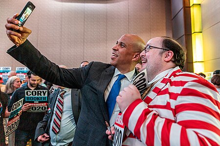 Cory Booker takes a selfie with a supporter