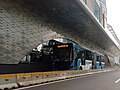 A Transjakarta Scania articulated bus entering Tosari station, 2024