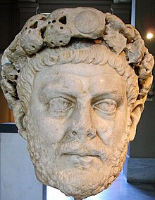 Statue of a male head wearing a diadem