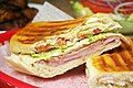 Image 2A Cuban sandwich is a variation of a ham and cheese sandwich that originated among the Cuban workers in the cigar factories in Key West, Florida[1][2]
