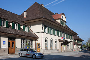 Three-story building with gabled roof