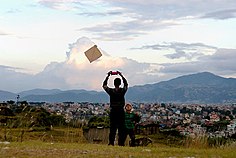 People fly kites during the Dashain festival holidays