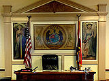 Main courtroom with images of lady justice and state seal of Missouri