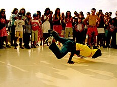 A bboy performing in a cipher for a crowd in Turkey.