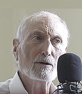Portrait photo of Dr Michael Klaper speaking into microphone