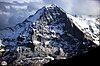 Snow covered mountain in sunlight