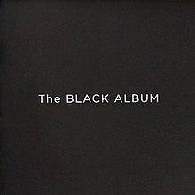 The words "The BLACK ALBUM" in a large, white font against a black background