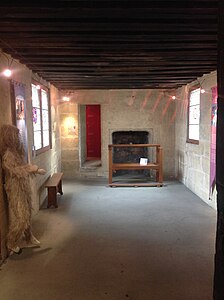 The lower of the two chambers in the tower. The door to the left of the fireplace led to the latrine.