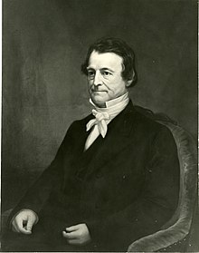A portrait of Charles Hooker sitting.