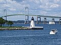 Newport Harbor Light (1842) on northern tip of Goat Island and the Newport Bridge