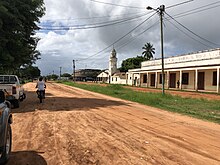 A street view of Pebane's main village centre with a small church