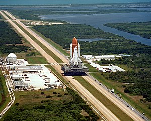 Space Shuttle Challenger atop an MLP atop a crawler, in transit to its launch pad prior to its final flight, January 28, 1986