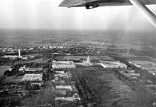 Large buildings surrounding green quadrangle