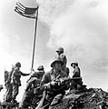 This is a photograph of soldiers rising a US flag on Iwo Jima, but it is not exactly Raising the Flag on Iwo Jima