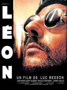 Image of Jean Reno as Léon: he is bearded and wearing sunglasses looking upwards.