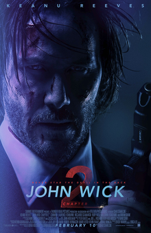 The protagonist John Wick appears disheveled holding a pistol