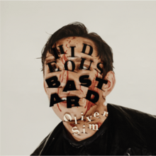 A photo of the artist with the letters of the album sticking out of bloody cuts in his face.