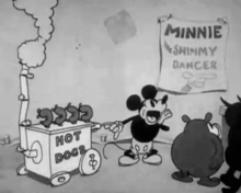 As audiences watch an off-screen dance, Mickey Mouse operates a hot dog stand, calling out to others