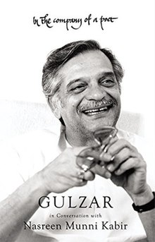 Cover of In the Company of a Poet, featuring Gulzar smiling away from the camera and holding glasses.