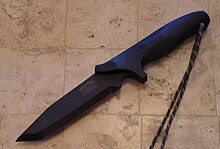 A black tanto bladed fighting knife.