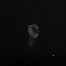 A black cover with a photograph of a black fist