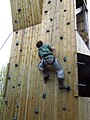 A fellow scout on a climbing tower. Note the footwear...