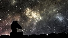 The silhouette of an animated horse stands out within a space observatory.