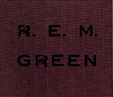 A crimson cover with rough-hewn texture that has "GREEN" and "R.E.M." debossed on it in black