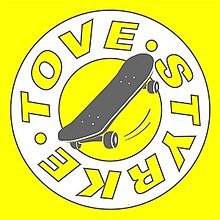 A single cover with an illustrated skateboard with name of the artist written in a white circle over a yellow background.