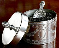 A silver plated tea caddy and a caddy spoon