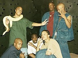 The group in 1996. Standing: Napoleon, E.D.I Mean, and Hussein Fatal; Below: Kastro, Tupac, and Yaki Kadafi