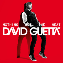 Against a red background, David Guetta leans against a wall, with a shadow seen behind him.
