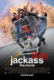 Six gleeful men ride in a massive shopping cart, while three other men hang off the sides. The title is written below, with the tagline "With stuff you'd never see on TV" stamped above.