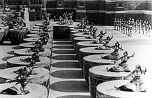 Women dancing on giant drums