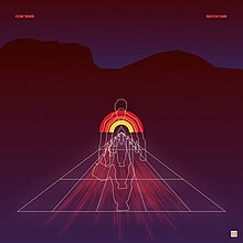 The image shows an album cover with a dark background and a geometric design of a human figure in the center. The figure is depicted with outlined segments in white and appears to be walking forward. The figure is set against a triangular grid that extends into the distance, with rays of light emanating from the bottom. In the top left corner, the text "Com Truise" is written, and in the top right corner, the text "Silicon Tare" appears.