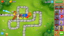An in-game screenshot of several different monkeys attacking the Bloons and supporting each other.