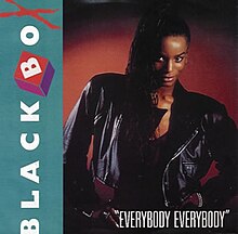 The cover is vertically split in two disproportionate sides; the left side is turquoise-coloured with the artist name in capitalised white font; the white side contains a woman standing with her hands on her hips while wearing a black leather jacket. The song title is placed underneath the woman's hips