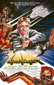 A film poster with a young man with a laser gun extended from his arm, shooting out the title "Laserblast". A tagline at the top reads "Billy was a kid who got pushed around ... Then he found the power". The top left shows two extraterrestrial aliens on top of a burning building, opposite an extraterrestrial spacecraft. Below the burning building, people are seen running away on the street. Credits for the film appear below the title, and a skeleton on fire is at the bottom of the image.
