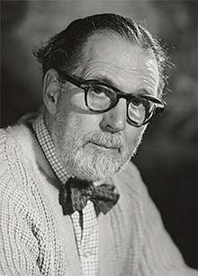 Bird, a man in his sixties, wearing spectacles, a bow tie, and a short, neat beard.