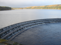 A view over Fewston Reservoir, with the overflow in the foreground